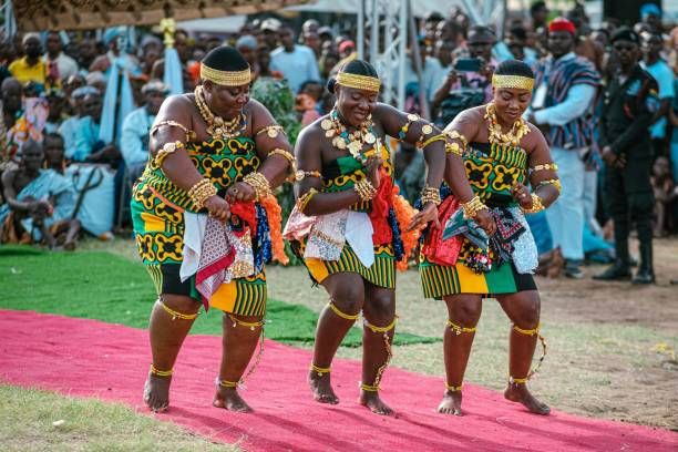 Traditional dancers in kente at a festival
